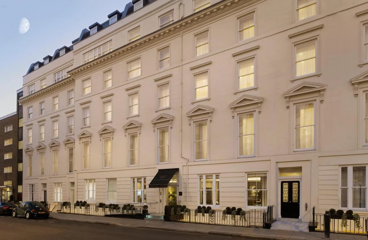 a large white building on the corner of a street at The Westbourne Hyde Park in London